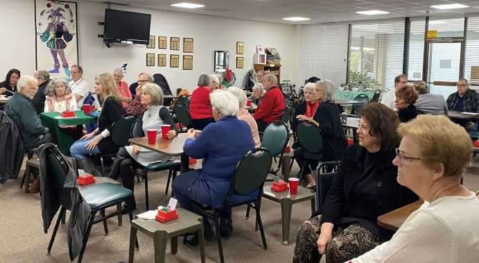 Members listening to presentation at Christmas party